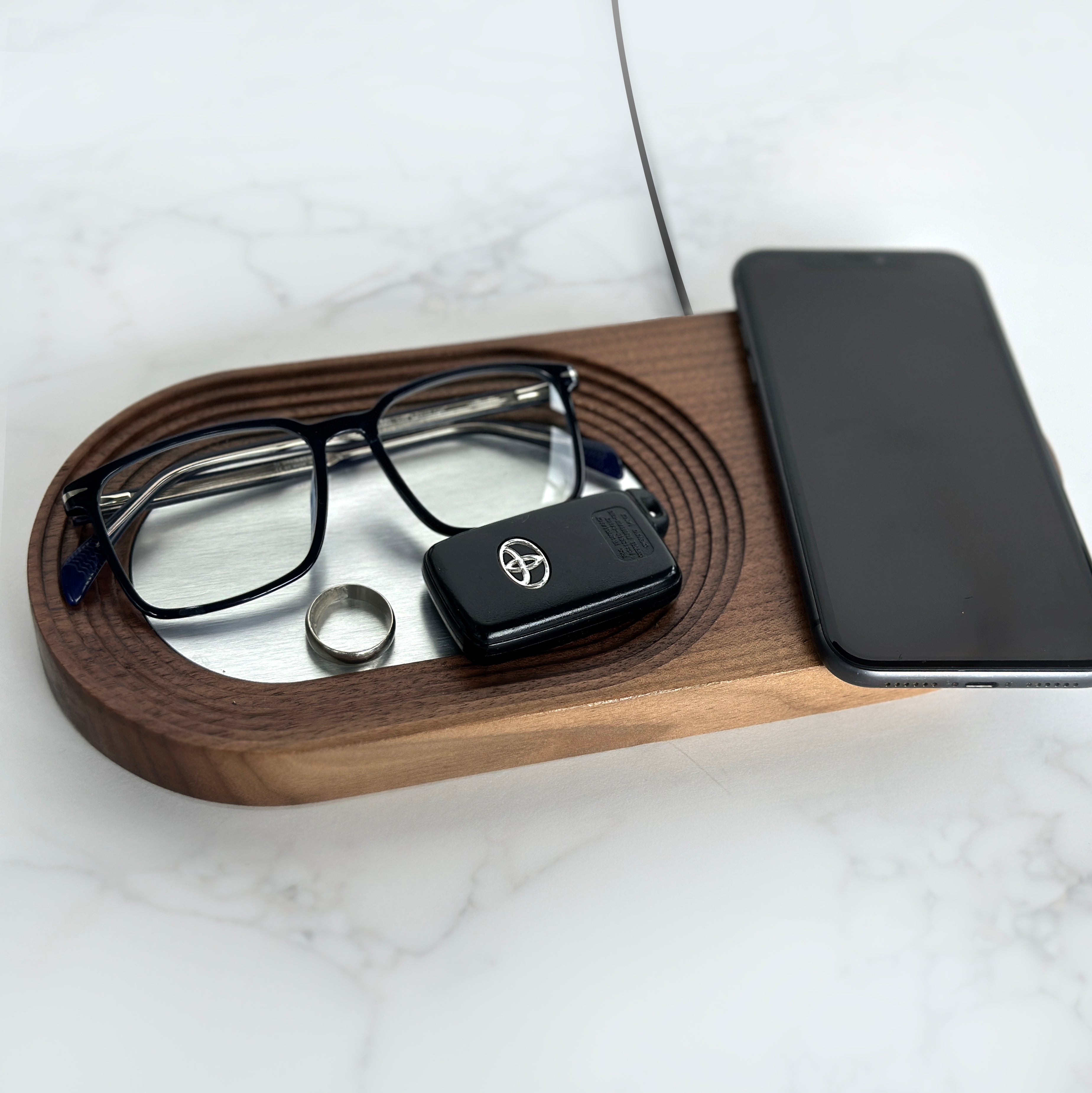 Full catchall tray with glass, ring and car key